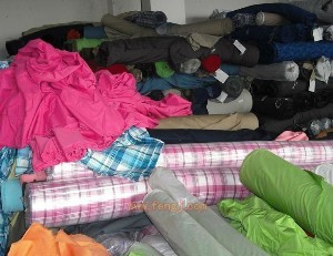 深圳收购布料-深圳品源库存布料服装回收公司